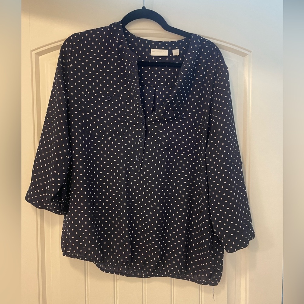 Blue and white polkadot blouse.